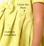 Neon green cotton dress for girls with classic box pleats